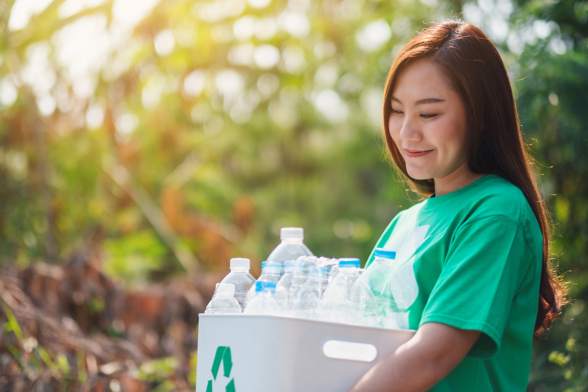 a-woman-collecting-garbage-and-holding-a-recycle-b-2024-12-01-03-19-03-utc a-woman-collecting-garbage-and-holding-a-recycle-b-2024-12-01-03-19-03-utc